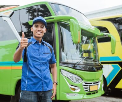 bus-driver-uniform-hat-smiles-with-thumbs-up-against-background-bus_8595-22063