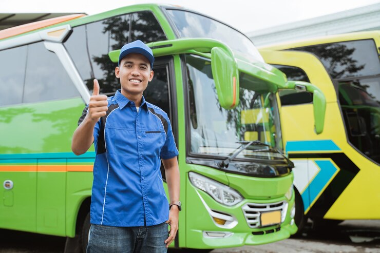 bus-driver-uniform-hat-smiles-with-thumbs-up-against-background-bus_8595-22063